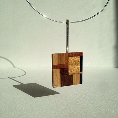 wood and silver pendant